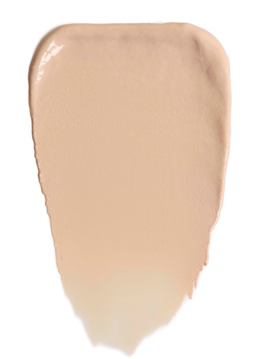 Ein beige Make-up-Proben mit abgerundetem oberen Teil und schmalerem unteren Teil. Es sieht glatt und cremig aus.