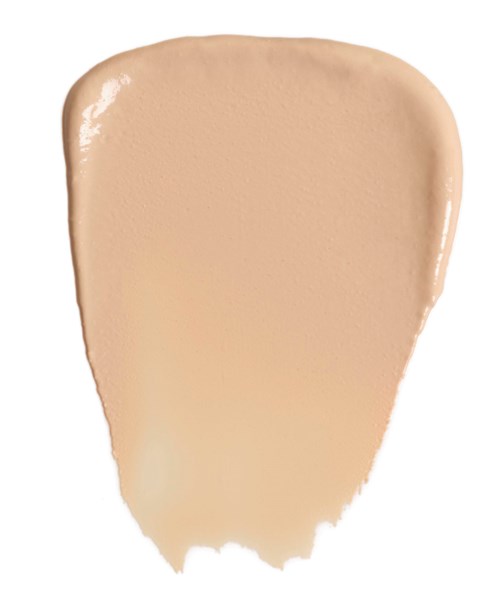 Eine beigefarbene Flüssigkeit oder Creme mit glatter Textur und runder Form.