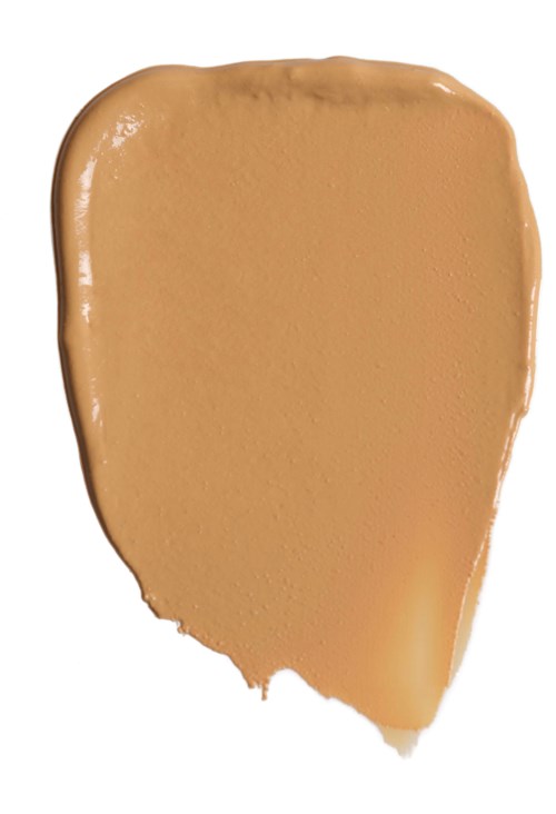 Ein Streifen beigefarbene Foundation mit unregelmäßigen Kanten. Es sieht aus wie Flüssigkeit oder Creme.