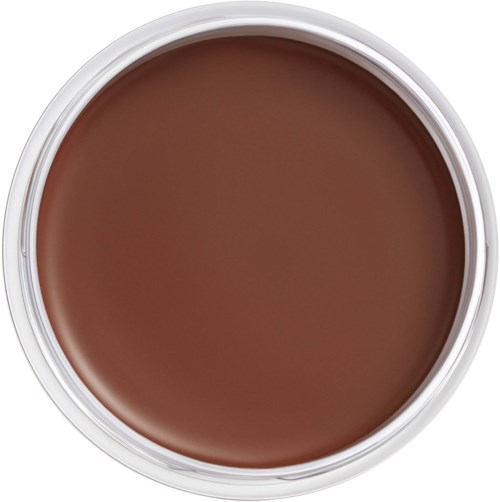 A round container filled with brown cream or paint. The container has a white rim.