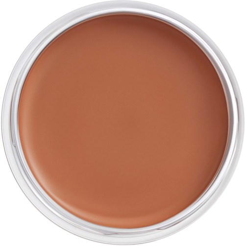 A round container with light brown cream or makeup inside, surrounded by a white plastic or metal rim.