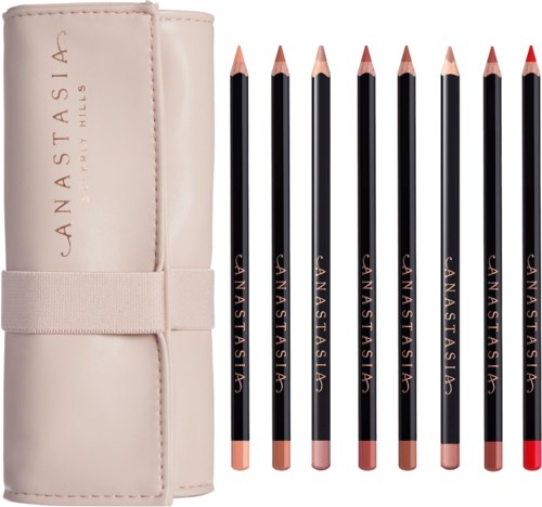 Sju makeup-penna i ett ljusrosa fodral med olika nyanser, märkt med 'Anastasia'.