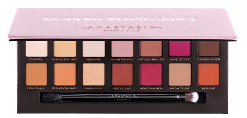 A makeup palette with 12 shades in pinks, oranges, and browns, and a small brush included.