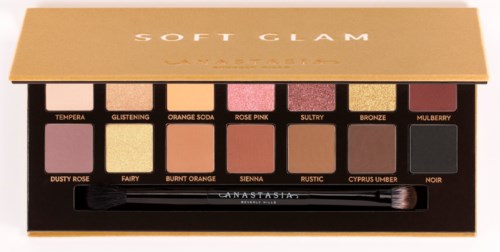 Eine Lidschattenpalette mit 12 Farben in einer schwarzen Box mit Pinsel.