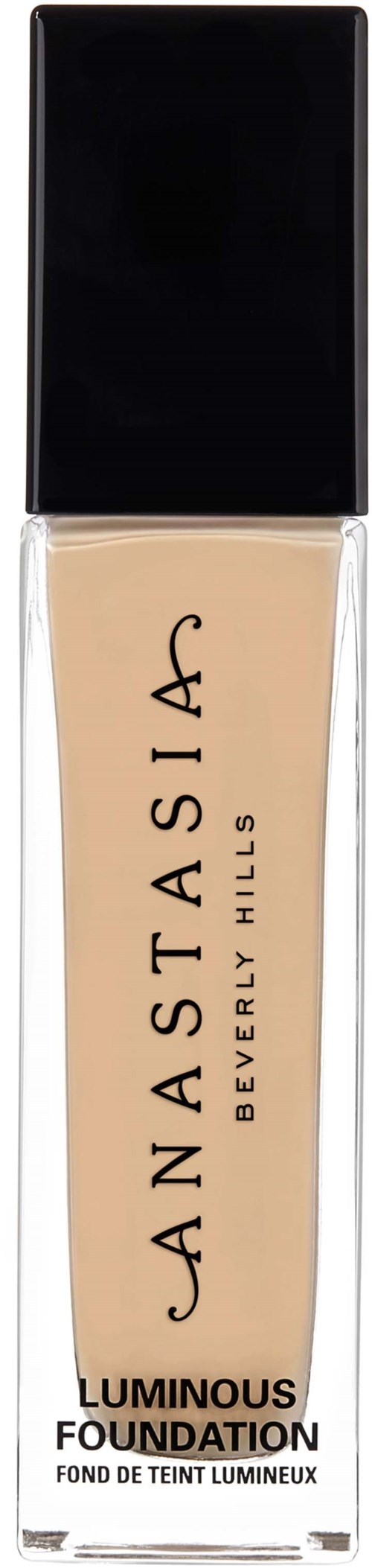 Pituuslämpöinen, beige nestemäisellä meikkivoiteella varustettu pullo, jossa on musta kansi ja etiketti, nimeltään Anastasia Beverly Hills, Luminous Foundation.