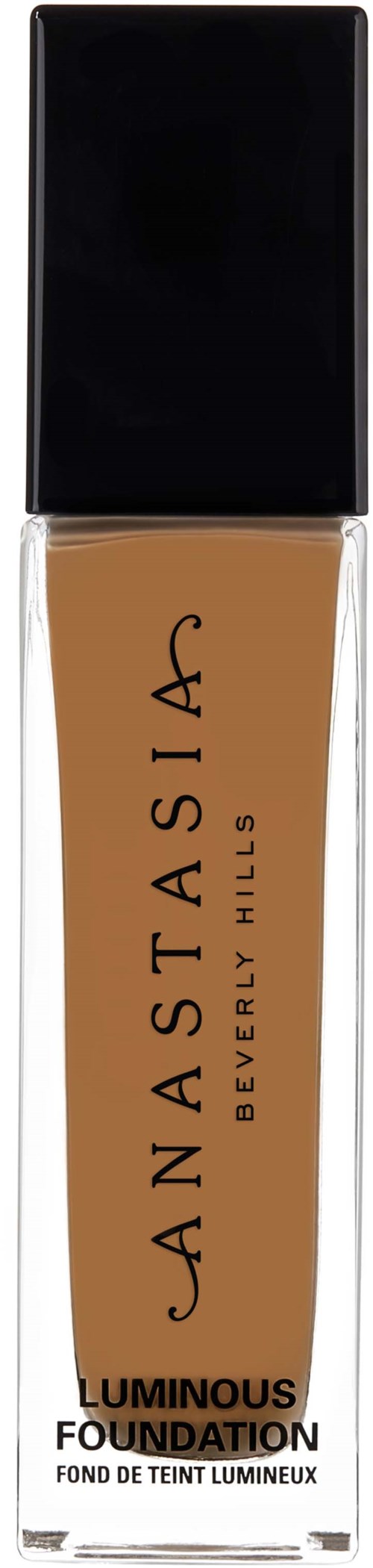 Lång flaska med foundation, beige vätska, svart lock och Cannastasia Beverly Hills-logga på framsidan.