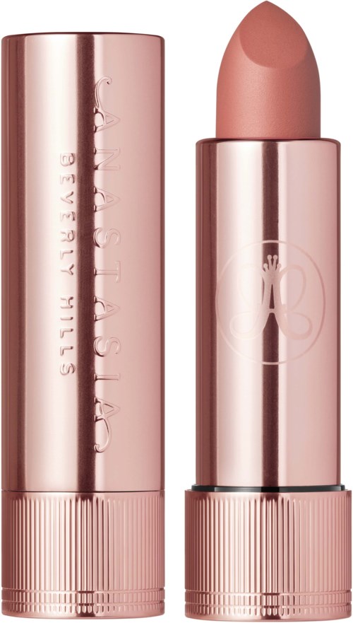 Ein pinkfarbener Lippenstift mit abgeschraubter Kappe, zeigt den Lippenstift in beigem Farbton.
