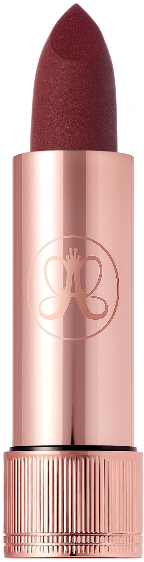 A lipstick in a pink tube with a butterfly logo, showing a dark red color.