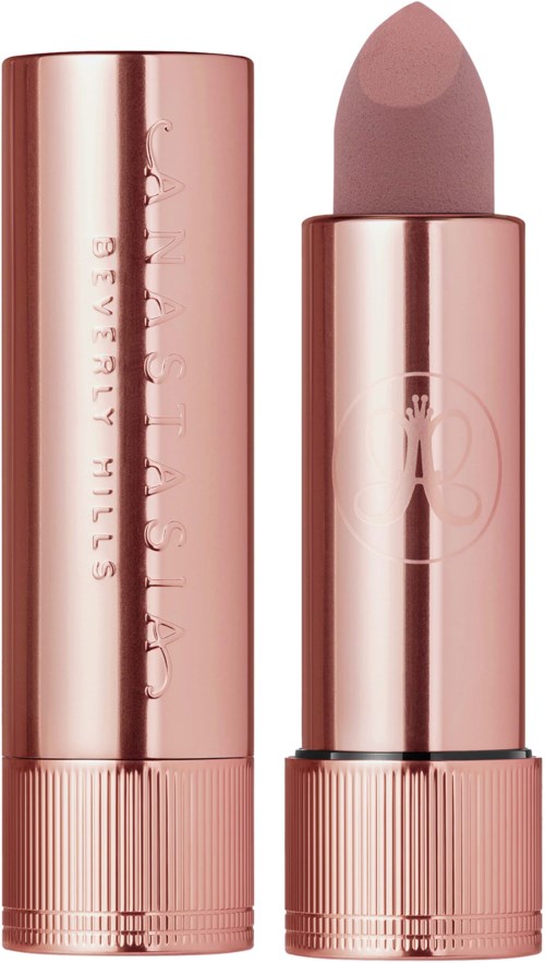 Ein rosegoldfarbener Lippenstift ohne Deckel, zeigt die Farbe im Inneren.