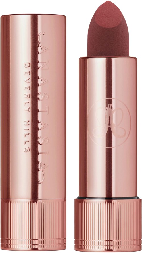 A pink metallic lipstick with the cap removed, showing a brownish lipstick inside.