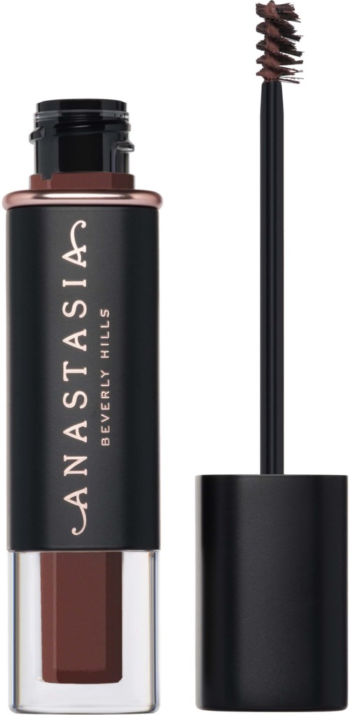 Een tube met bruin vloeibaar lippenstift met applicator, zwarte dop en zwart label met witte tekst. Beverly Hills.