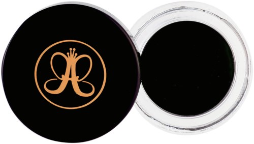 Een kleine ronde container met zwart gel en een zwarte deksel met een oranje logo van een vlinder binnen een cirkel.