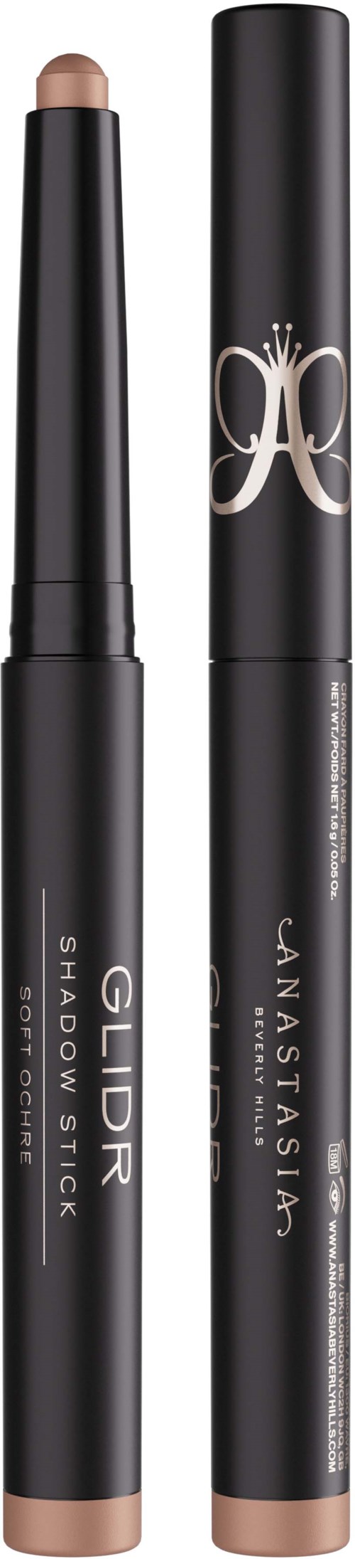 Twee zwarte make-upproducten, één gelabeld 'GILD Shadow Stick' en de andere met een decoratief zilveren embleem.