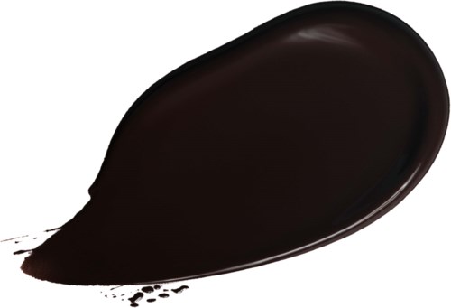 Schwarze Flüssigkeit oder Farbfleck auf einer weißen Oberfläche.