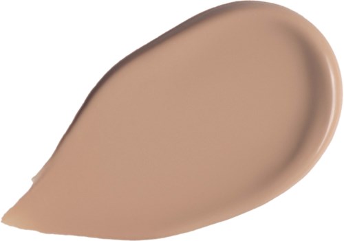 Eine Tropfenform aus beiger Flüssigkeit, wahrscheinlich Foundation oder Concealer, auf weißem Hintergrund.