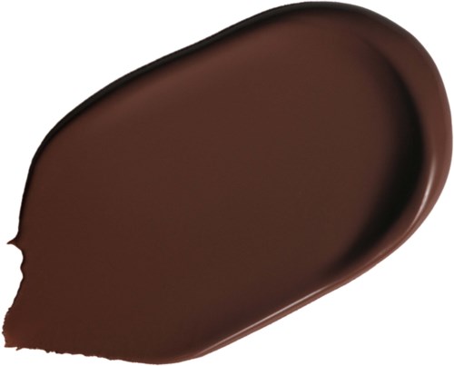 Ein brauner Make-up- oder Foundationschmutz auf schwarzem Hintergrund.