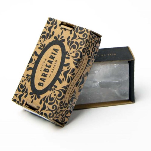 A cardboard box with a decorative design and the words "Antiga Barelara" on it, partially open to show ice.