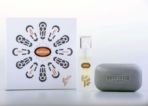 A grooming set with a soap bar, a spray bottle, and a grooming guide, all related to beard care.