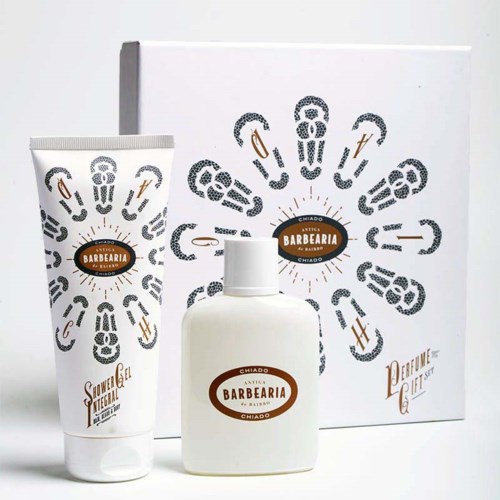 Set includes a body lotion, a bottle, and a decorated box with barber-themed designs and logo.