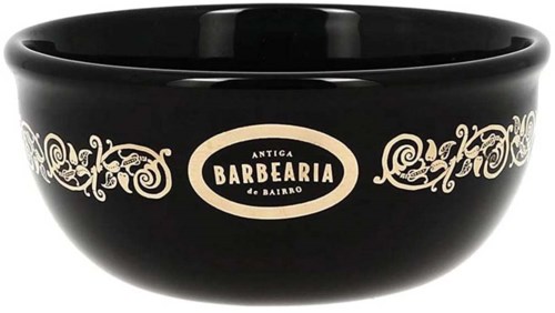 A black bowl with white decorative patterns and the words "Antiga Barberia de Bairro" in the center.