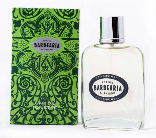 A green box and a clear perfume bottle with black and white labels, both bear the words 'Antiga Barbearia'.