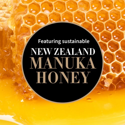 Nachhaltiger Manuka-Honig aus Neuseeland mit Wabe im Hintergrund.