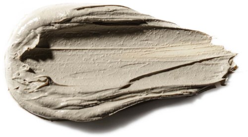 Eine Portion beige oder hellbraune Creme oder Aufstrich mit Streifen und cremiger Textur.