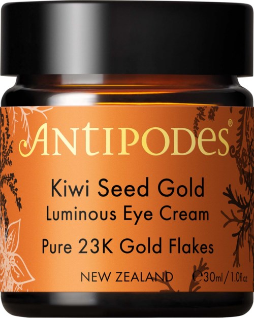 Ein Glas mit Antipodes Kiwi Seed Gold Luminous Eye Cream mit orangefarbener Beschriftung und schwarzem Deckel.