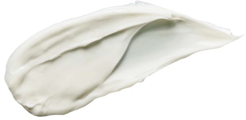 Eine dicke, weiße Creme auf schwarzem Hintergrund, zeigt glatte Textur und weiche Kurven.