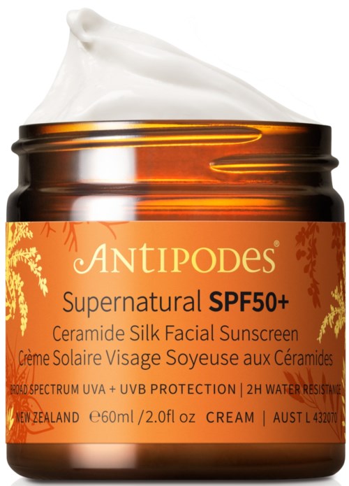 Creme in Glas mit orangeem Etikett, SPF 50+ Sonnenschutz für das Gesicht, enthält Ceramid, UV-Schutz, wasserfest.