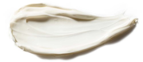 Ein Wirbel aus weißer Creme oder Lotion auf einer flachen Oberfläche mit einfachem Hintergrund.