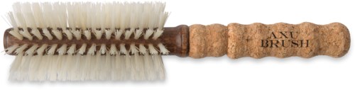 A small brush with white bristles and a wooden handle, used for cleaning shoes.