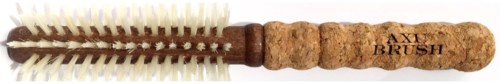 A cleaning brush with a cork handle labeled "AXI BRUSH," has cream and brown bristles for cleaning bottles.