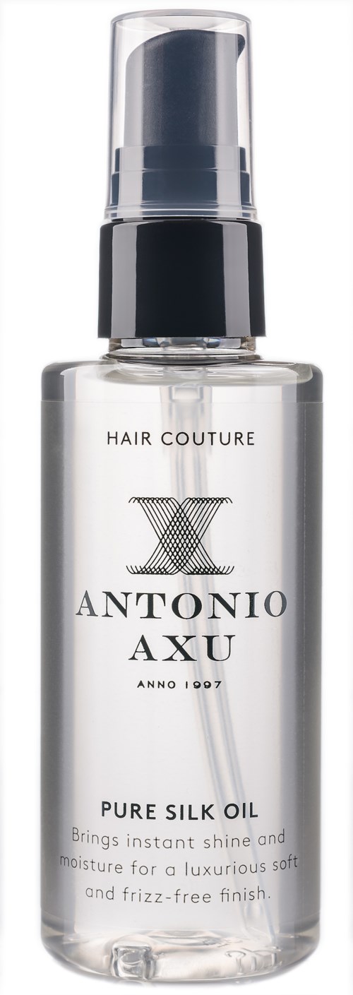 Przezroczysta butelka z rozpylaczem oznaczona 'Antonio Axu Pure Silk Oil' do pielęgnacji włosów.
