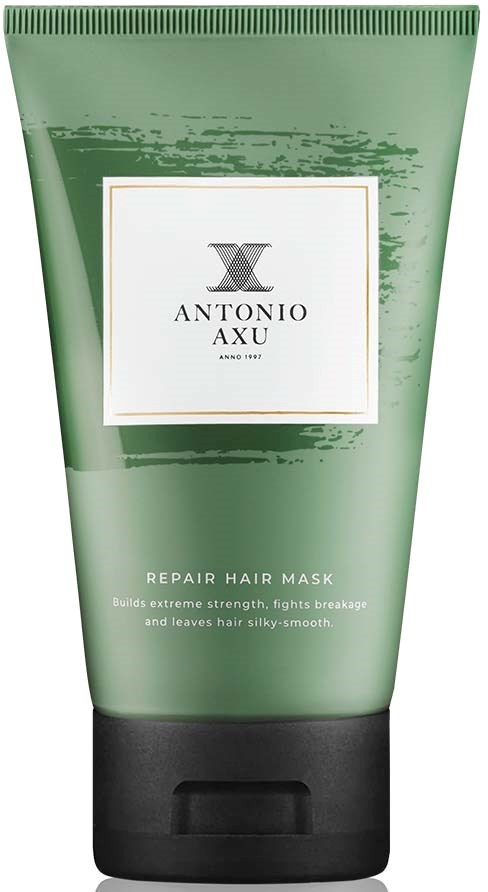 Grønn tube med svart lokk, merket Antonio Axu Repair Hair Mask, hjelper med å styrke og glatte håret.