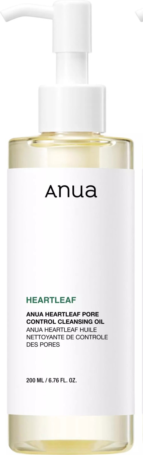 Een doorzichtige fles met een witte pomp, gelabeld "Anua Heartleaf Pore Control Cleansing Oil."