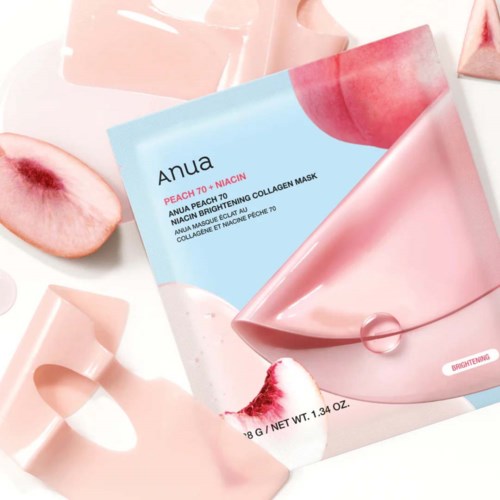 Persikanvärinen ihonhoitonaamio pakkauksella persikkaista ja pinkistä lastaa.