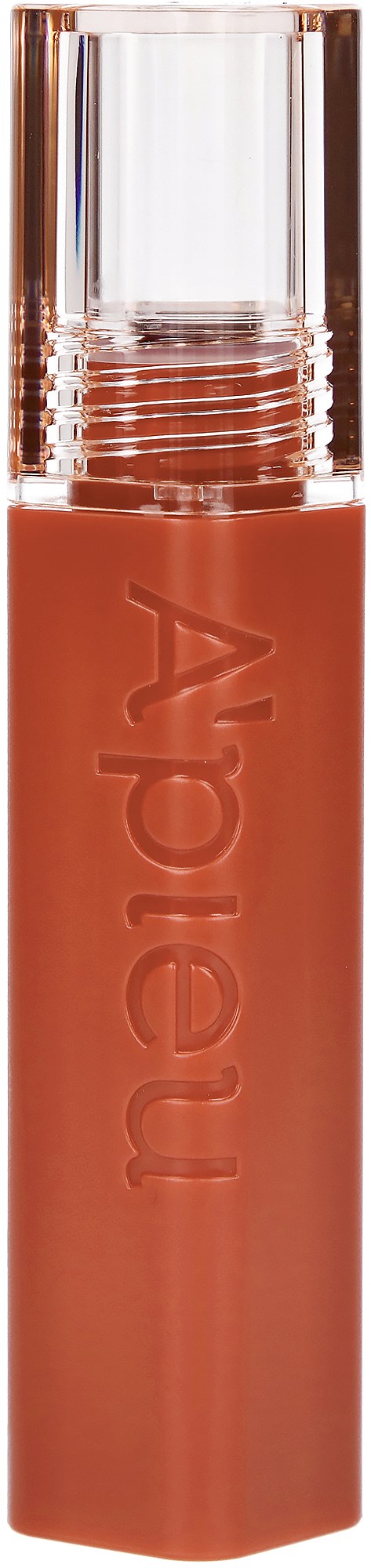 Een lipstick met een doorzichtig deksel in roze-bruin kleurtje. De tube heeft de tekst "A Pieu" erop.