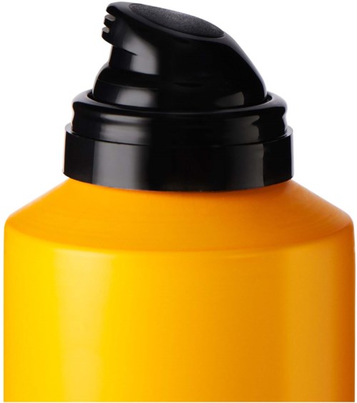 Gelbe Flasche mit schwarzem Klappdeckel, wahrscheinlich für Haar- oder Körperpflegeprodukt.