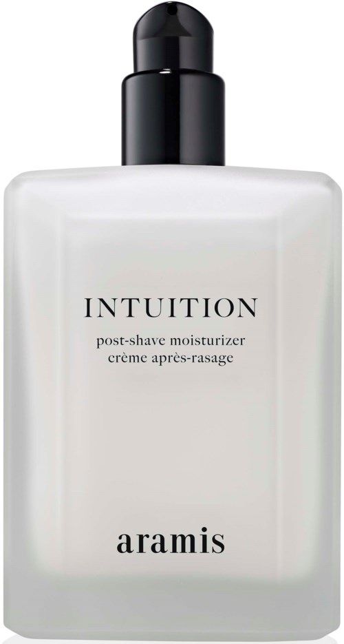 En vit flaska av Aramis Intuition aftershave-kräm med svart lock.