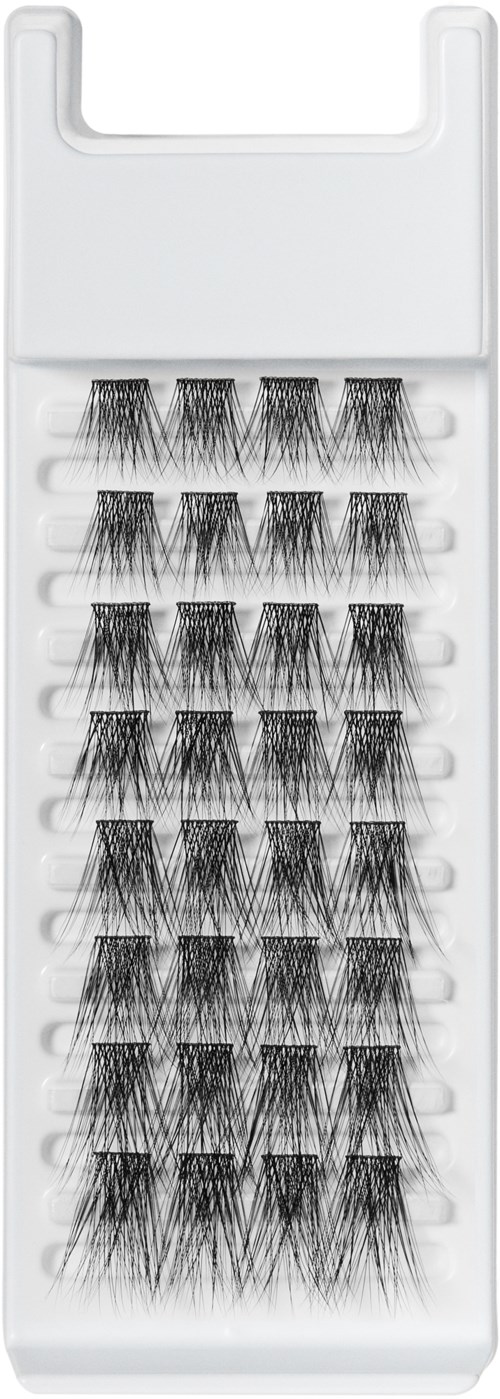 Multiple sets of false eyelashes in a white plastic tray.