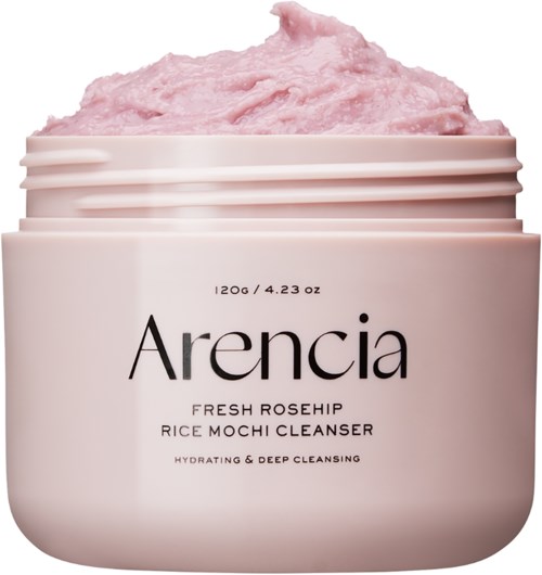 Ein rosa Gefäß mit Arencia Rice Mochi Cleanser und rosa Schaum oben.