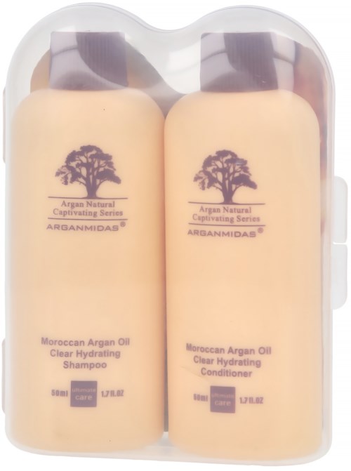 Zwei kleine Flaschen marokkanisches Arganöl-Shampoo und Conditioner in einem transparenten Kunststoffbehälter.