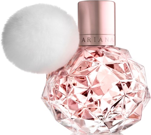 Een roze parfumfles met een geometrisch glazen ontwerp en een fluffy witte pompom.