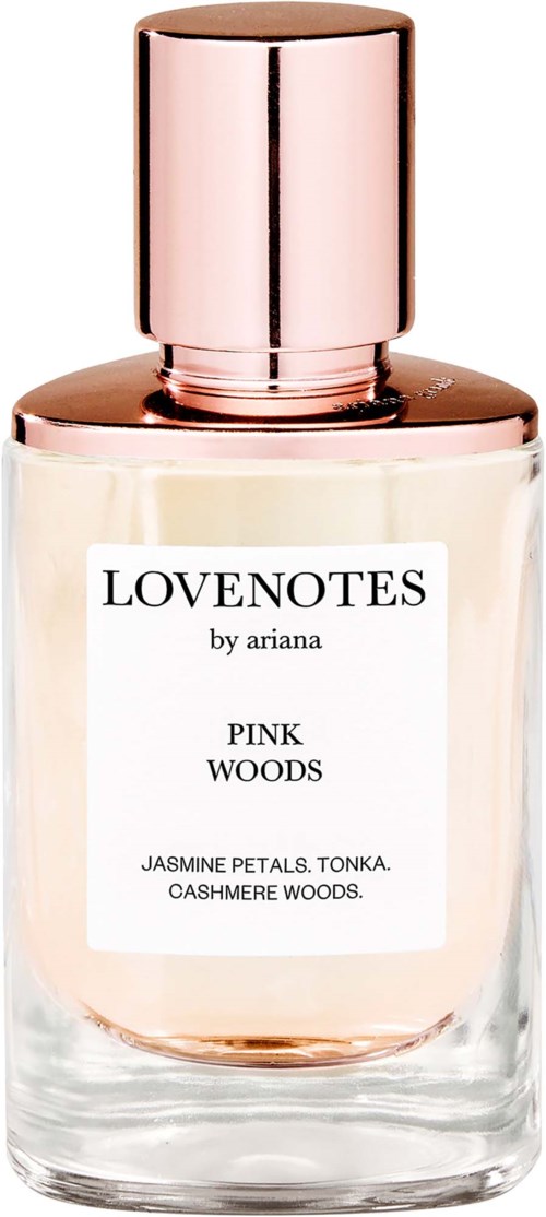 Glassparfymeflaske med rosa væske og en rosegullhette, etiketten viser Lovenotes av Ariana Pink Woods med jasmin, tonka og cashmere Woods.