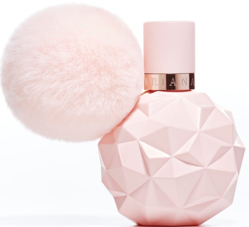 Een roze, geometrisch parfumflesje met een fluffy roze pompon en een witte dop.