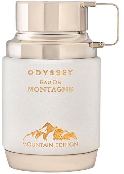 En vit och guld parfyll flaska med bergdesign, märkt 'Odyssey Eau de Montagne Mountain Edition'.