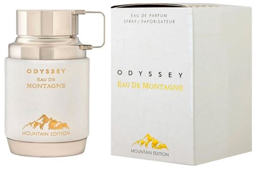 En vit parfyllåda och dess box med berg och text, märkta som Odyssey Eau de Montagne Mountain Edition.