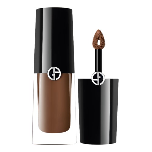 A brown liquid lipstick with a black cap and a logo, with the applicator next to it.