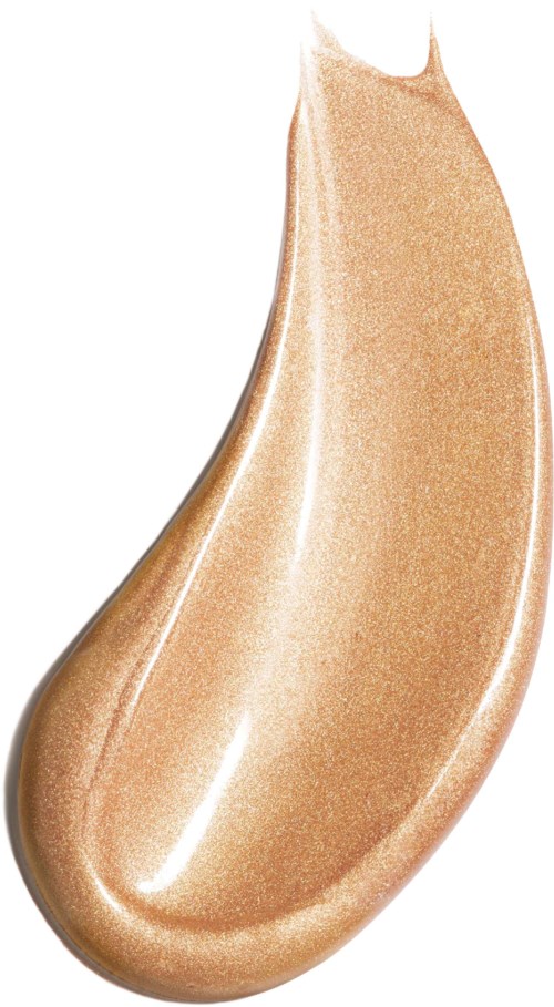 Beige, kiiltävä, pisaran muotoinen meikkituote, jossa terävä ja pyöreä pää.